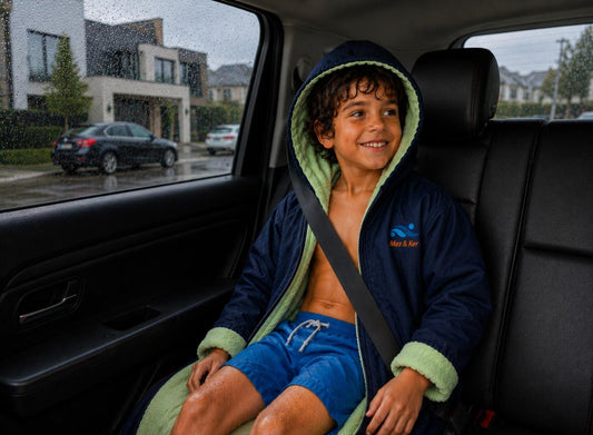 Boy wearing Mez&Ker Kids Swim and Sports Parka in a car after swimming 